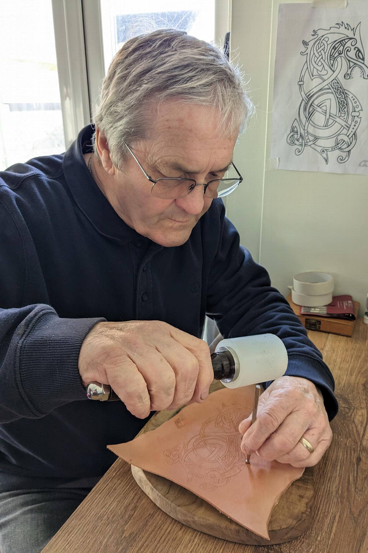 Man attending a leather tooling course
