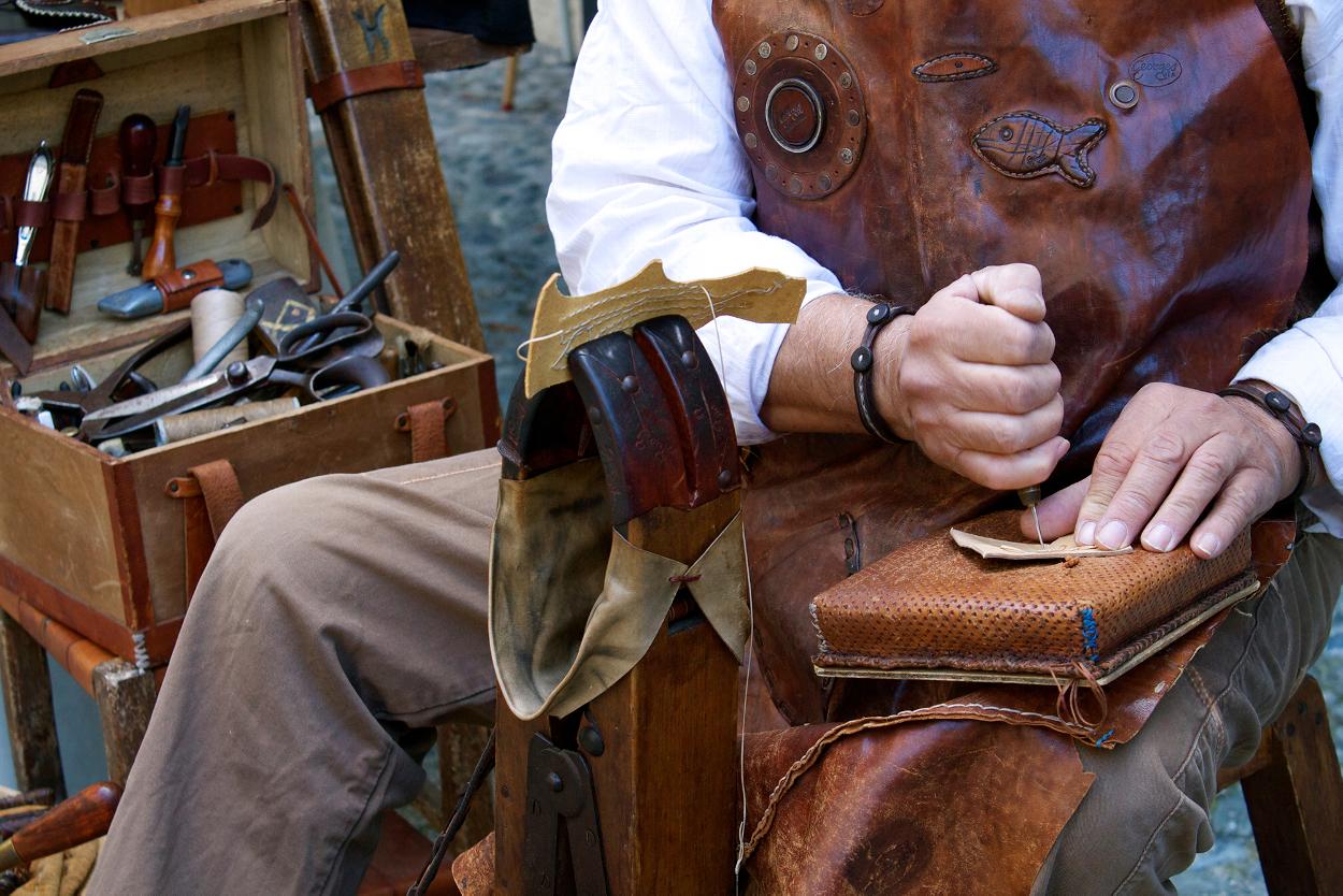 Man hand tooling a piece of leather