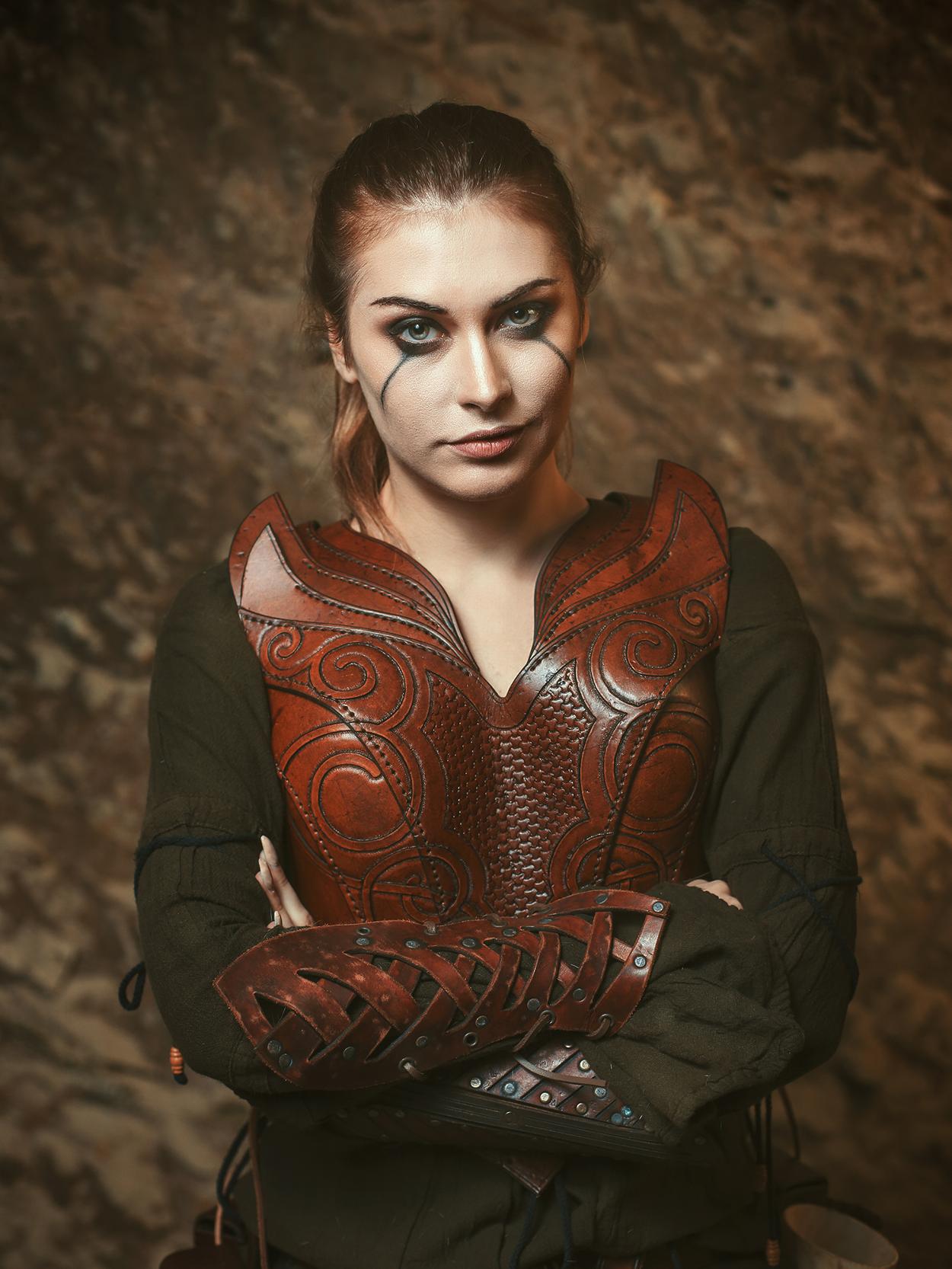 Woman wearing fantasy styled leather armour for cosplay